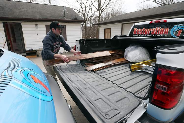 Restoration 1 man loading boards
